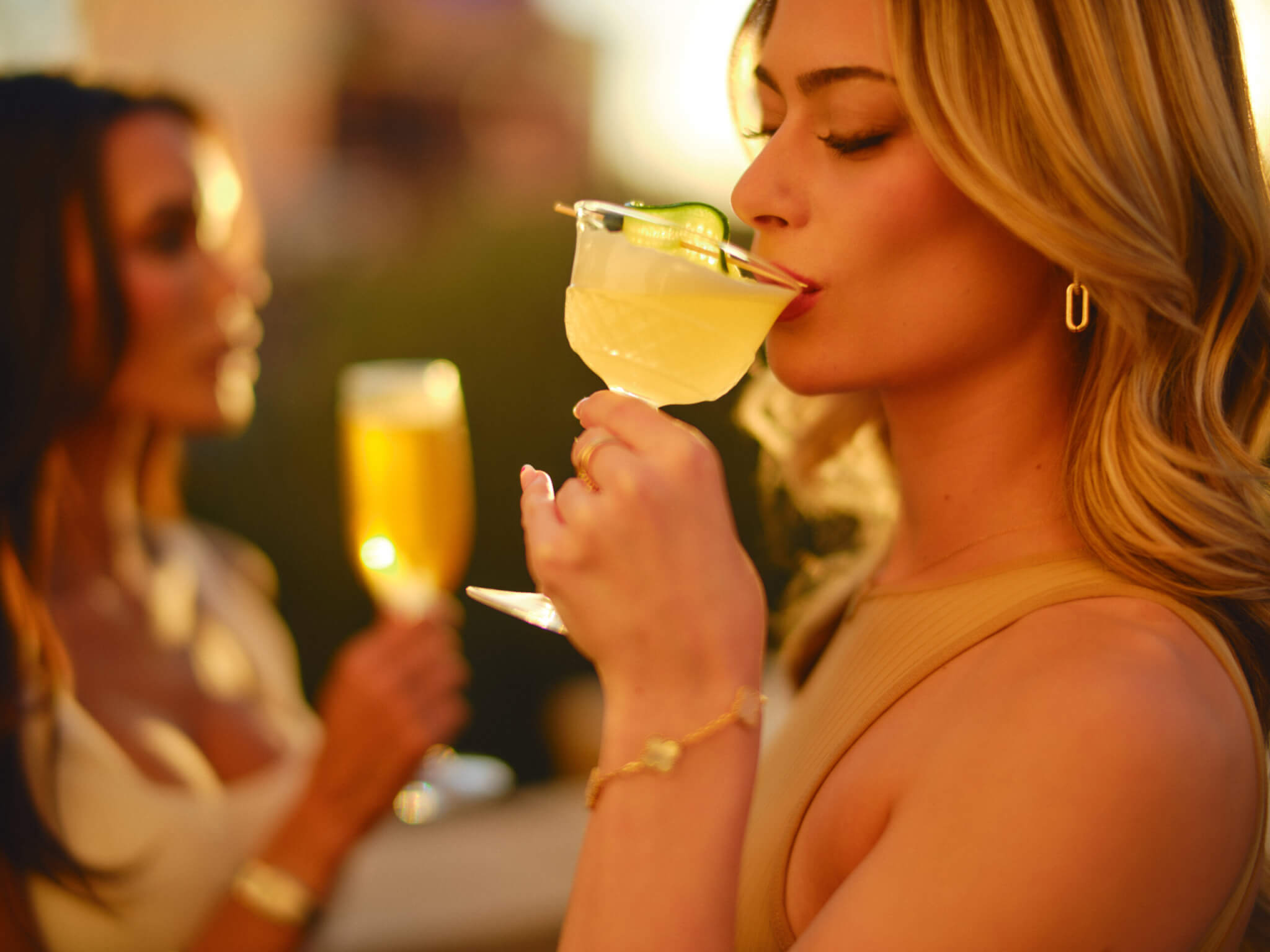 Girl sipping cocktail